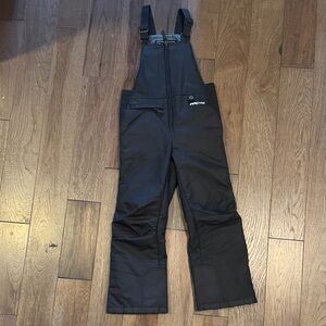 Arctix black snow bib pants in size small.
